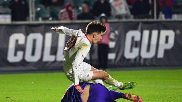 Dec 12, 2022; Cary, NC, USA; Indiana forward Tommy Mihalic (10) fails over Syracuse goalkeeper Russell Shealy (1) while Shealy makes a save in overtime at WakeMed Soccer Park. 